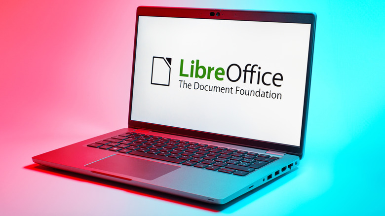LibreOffice logo displayed on a laptop on a pink and blue background