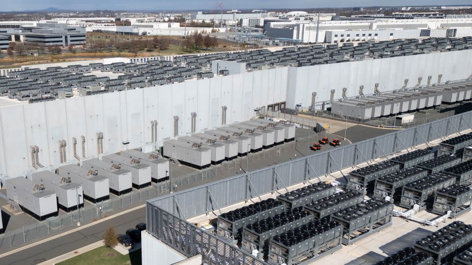 Air conditioning fans on the roof of Digital Realty's data center in Ashburn, Virginia on November 12, 2025. - Andrew Caballero-Reynolds/AFP/Getty Images